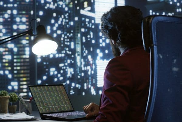 Private equity associate evaluating financial models