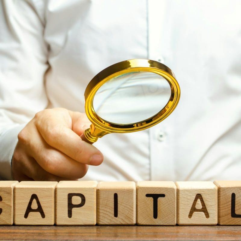 Businessman exploring the origin of capital